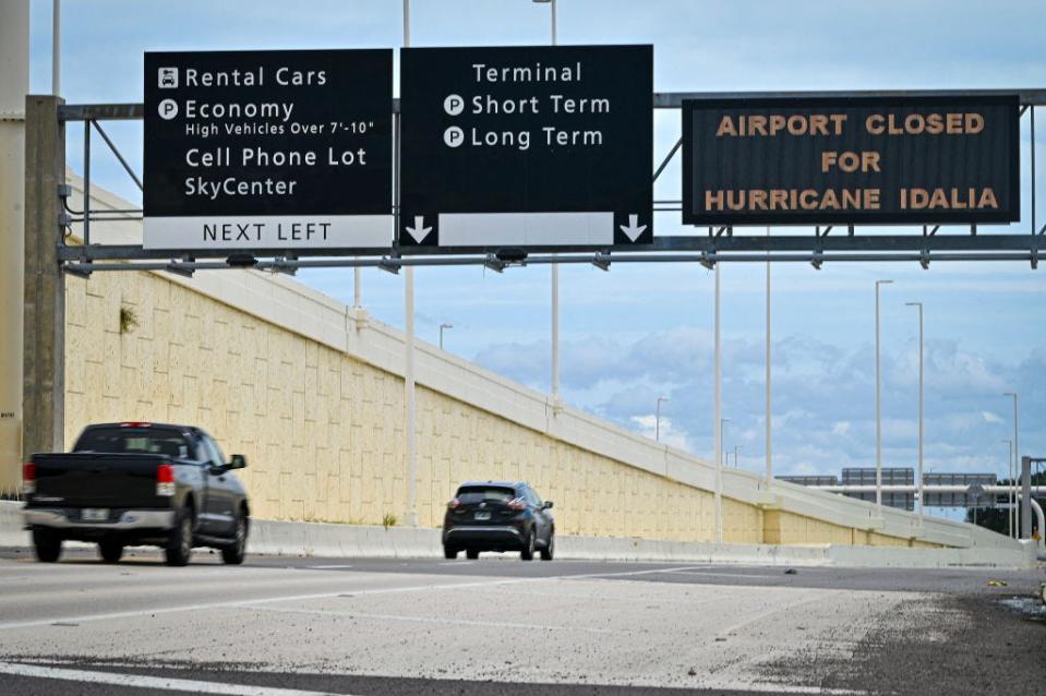 A sign informs travelers that Tampa International Airport was closed on August 29, 2023 ahead of Hurricane Idalia.