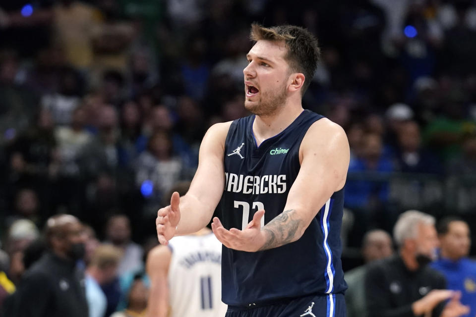 Dallas Mavericks guard Luka Doncic (77) reacts to a call during the second half against the Golden State Warriors in Game 3 of the NBA basketball playoffs Western Conference finals, Sunday, May 22, 2022, in Dallas. (AP Photo/Tony Gutierrez)