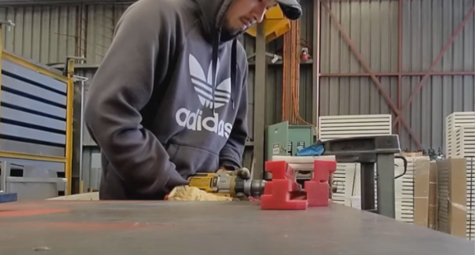 Tradie Shoma Tanak working at his metalworks factory job