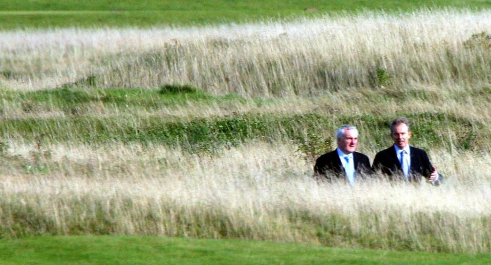 British prime minister Tony Blair and Irish taoiseach Bertie Ahern on the golf course at the Fairmont Hotel in St Andrews, Scotland (Lewis Whyld/PA) (PA Archive)