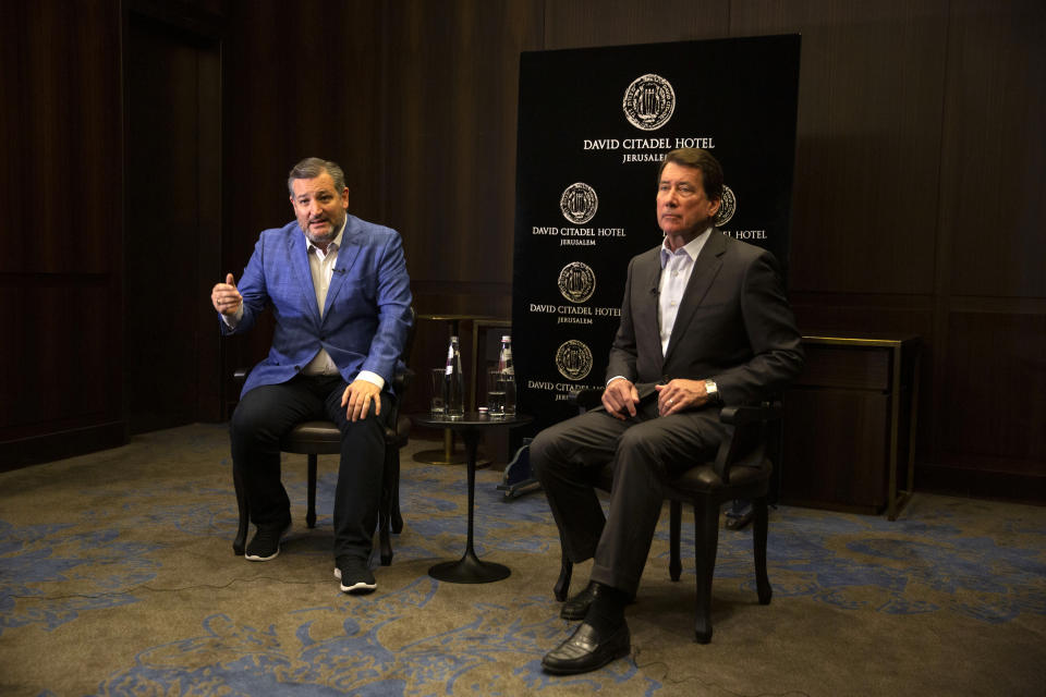 U.S. Sen. Ted Cruz, left, and U.S. Sen. Bill Hagerty speak during an interview with The Associated Press in Jerusalem, Monday, May 31, 2021. Cruz on Monday accused President Joe Biden of being soft on Israel's foes and inviting further violence during a deadly 11-day war that left Israelis rattled and turned parts of the Gaza Strip to rubble. (AP Photo/Sebastian Scheiner)