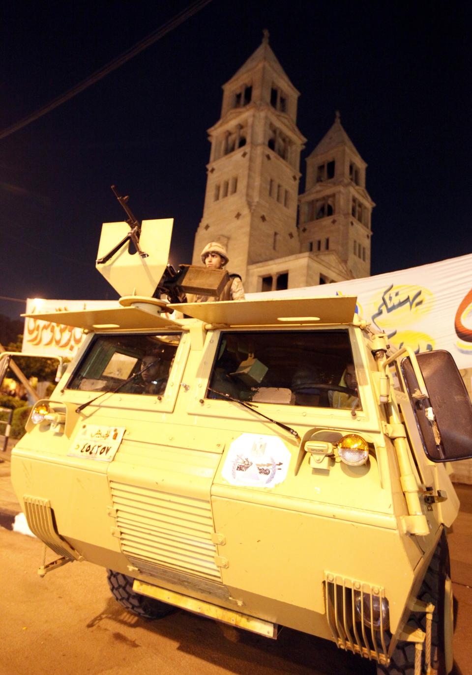 Army soldiers guard the streets during a Coptic Christmas eve mass at the main cathedral in Cairo