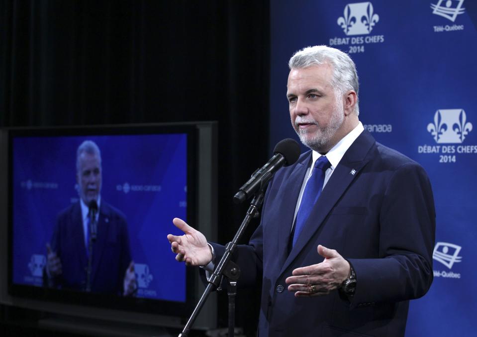 Quebec's liberal leader Philippe Couillard speaks to the media following the Leaders debate in Montreal, March 20, 2014. Quebec's governing Parti Quebecois, whose ultimate goal is to take the province out of the Canadian federation, is falling behind in the runup to the April 7 provincial election, a poll on Tuesday showed, with the federalist vote solidifying around the opposition Liberals. REUTERS/Christinne Muschi (CANADA - Tags: POLITICS ELECTIONS)