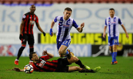 Soccer Football - FA Cup Third Round Replay - Wigan Athletic vs AFC Bournemouth - DW Stadium, Wigan, Britain - January 17, 2018 Bournemouth's Harry Arter fouls Wigan Athletic’s Ryan Colcough REUTERS/Phil Noble