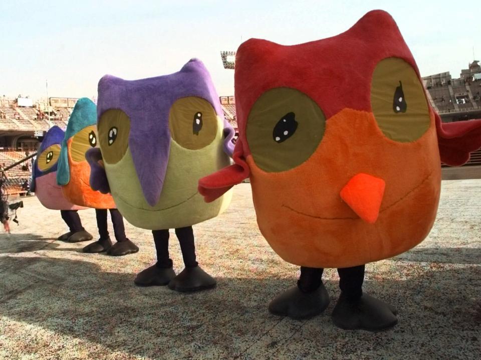 Snowlets, the Olympic mascots, walk around the stadium prior to the opening ceremony of the Winter Olympics at Minami Nagano Sports Park in Nagano, Japan on Feb. 7, 1998. (AP Photo/Eric Draper, File)