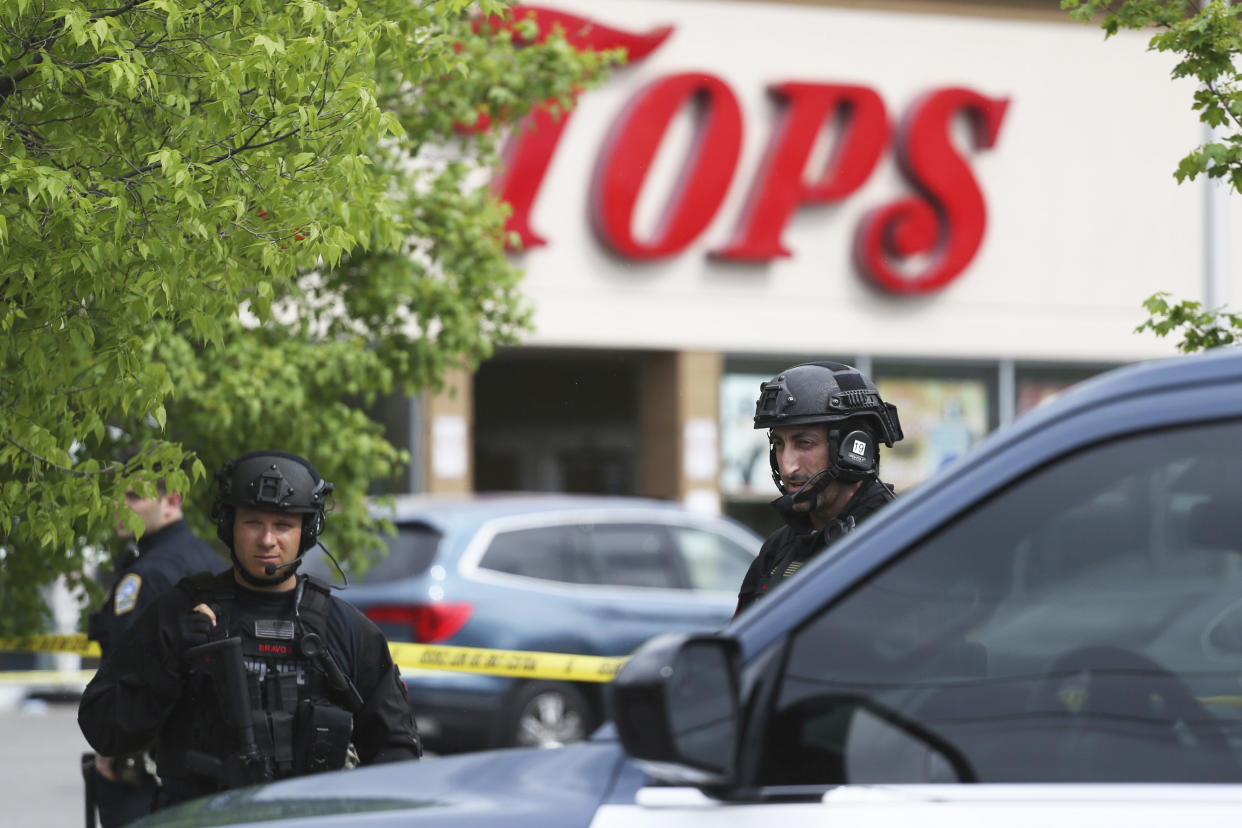 Police secure a perimeter after a shooting at a TOPS Market (Joshua Bessex / AP)