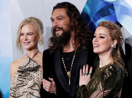 FILE PHOTO: Cast members Jason Momoa, Nicole Kidman and Amber Heard pose at the premiere for "Aquaman" in Los Angeles, California, U.S., December 12, 2018. REUTERS/Mario Anzuoni/File Photo