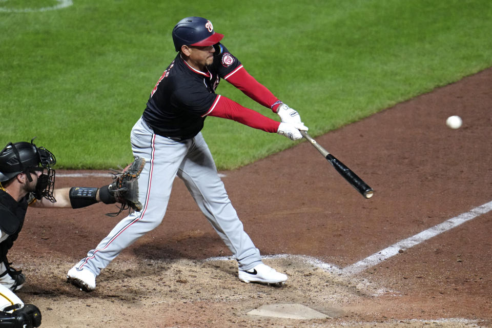 Washington Nationals' Ildemaro Vargas doubles to right field off Pittsburgh Pirates relief pitcher Aroldis Chapman, driving in two runs, during the ninth inning of the second baseball game of a doubleheader in Pittsburgh, Saturday, Sept. 7, 2024. (AP Photo/Gene J. Puskar)