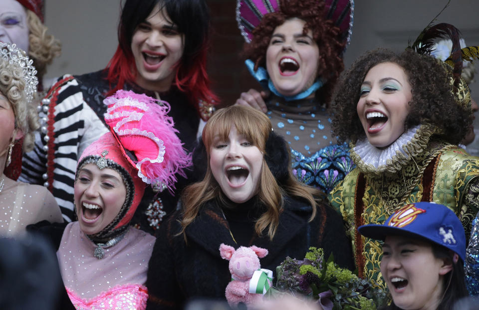 Actor Bryce Dallas Howard, center, Hasty Pudding Woman of the Year, laughs with Harvard University theatrical students, Thursday, Jan. 31, 2019, following a parade in the Harvard Square neighborhood, in Cambridge, Mass. The award was presented to Howard by Hasty Pudding Theatricals, a theatrical student society at Harvard University. (AP Photo/Steven Senne)