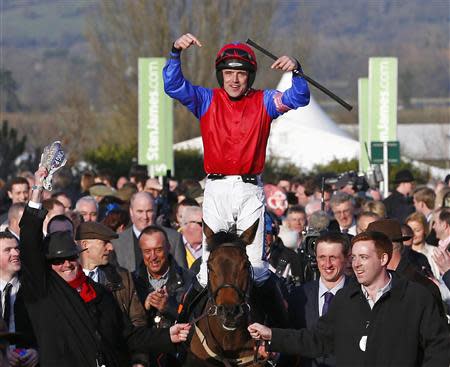 Ruby Walsh on Quevega celebrates after winning the Mares' Hurdle Race during the Cheltenham Festival horse racing meet in Gloucestershire, western England March 11, 2014. REUTERS/Eddie Keogh