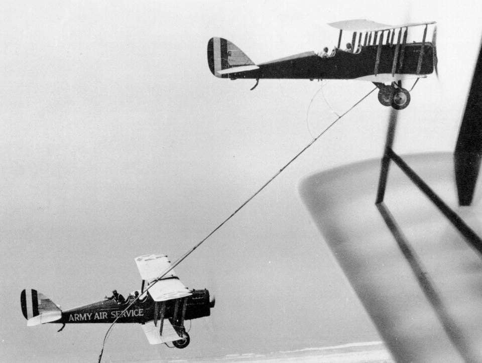 Another view of the DH-4B tanker as it trails its hose for the DH-4B receiver to grab over Rockwell Field. <em>U.S. Air Force</em><br>