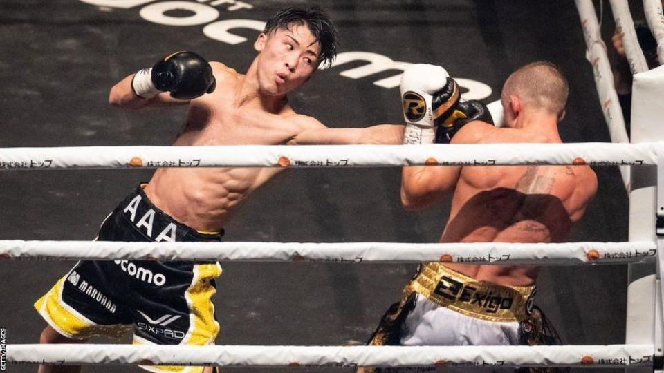 Naoya Inoue thows a left hook at Paul Butler in 2022