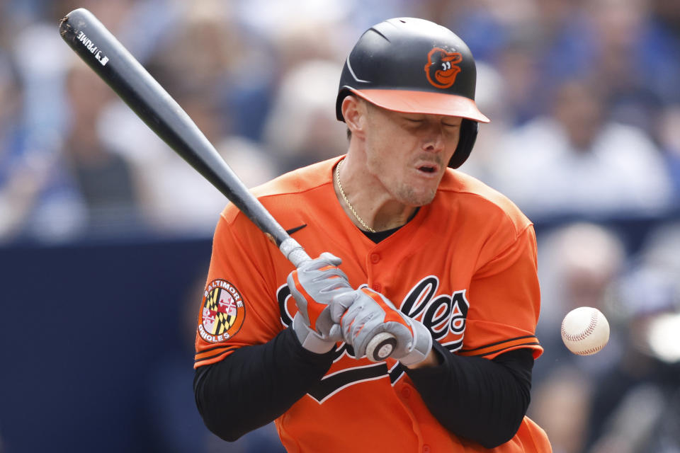 Baltimore Orioles Ryan Mountcastle (6) is hit by a pitch during the sixth inning of a baseball game against the Toronto Blue Jays in Toronto, Saturday, May 20, 2023. (Cole Burston/The Canadian Press via AP)