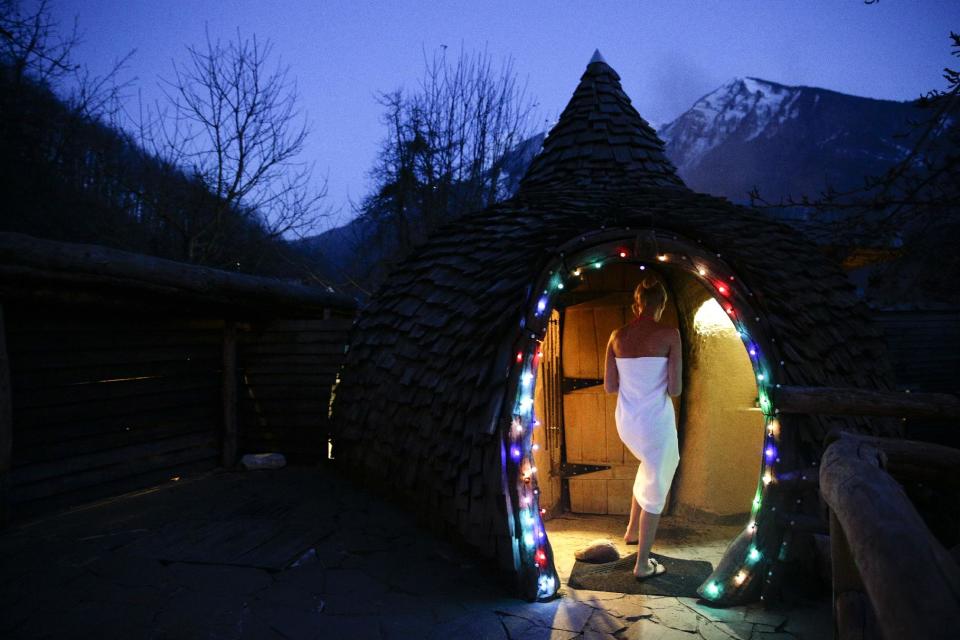 Olga Gharkova enters a aromatherapy room at the British Banya bathhouse, Saturday, Feb. 15, 2014, in Krasnaya Polyana, Russia, just a few miles away from the ski slopes where athletes are competing for Olympic medals. (AP Photo/Jae C. Hong)