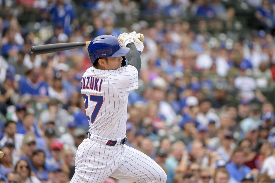 Chicago Cubs' Seiya Suzuki singles against the Miami Marlins during the first inning of a baseball game, Sunday, Aug. 7, 2022, at Wrigley Field in Chicago. (AP Photo/Mark Black)