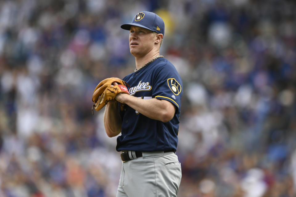 Milwaukee Brewers starting pitcher Chase Anderson reacts after giving up a two-run home run to Chicago Cubs' Nicholas Castellanos during the first inning of a baseball game Friday, Aug 30, 2019, in Chicago. (AP Photo/Paul Beaty)