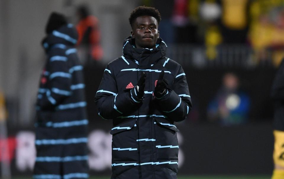 Bukayo Saka keeps warm during Arsenal's midweek trip to Norway - Stuart MacFarlane/Arsenal FC