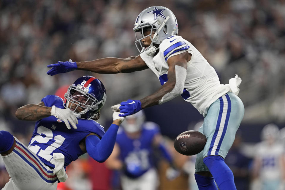 New York Giants safety Bobby McCain (21) breaks up a pass intended for Dallas Cowboys wide receiver Brandin Cooks, right, in the second half of an NFL football game, Sunday, Nov. 12, 2023, in Arlington, Texas. (AP Photo/Tony Gutierrez)