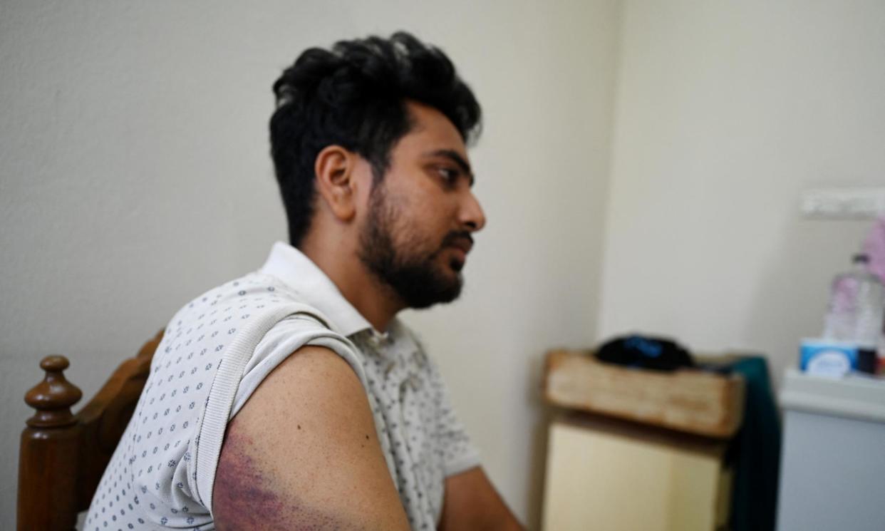 <span>Nahid Islam, a Dhaka University student, says he was picked up by police last week, tortured and left unconscious by the side of the road.</span><span>Photograph: Munir Uz Zaman/AFP/Getty Images</span>