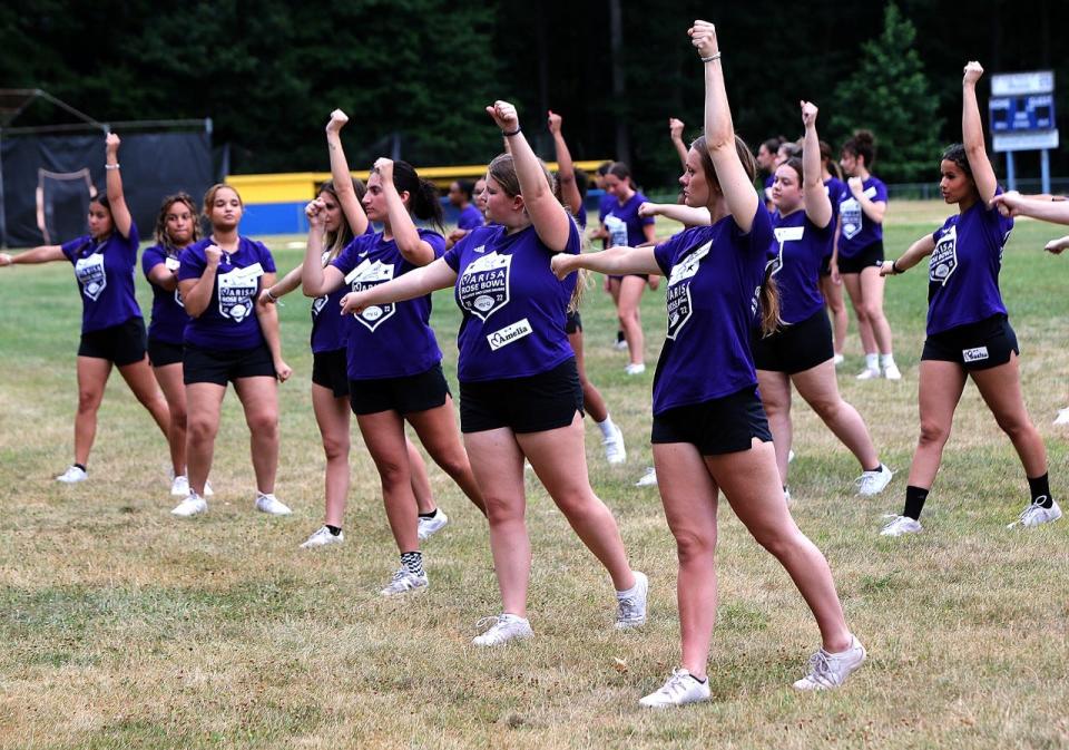 Cheerleaders practice their chants for the Marisa Rose Bowl on July 12, 2022