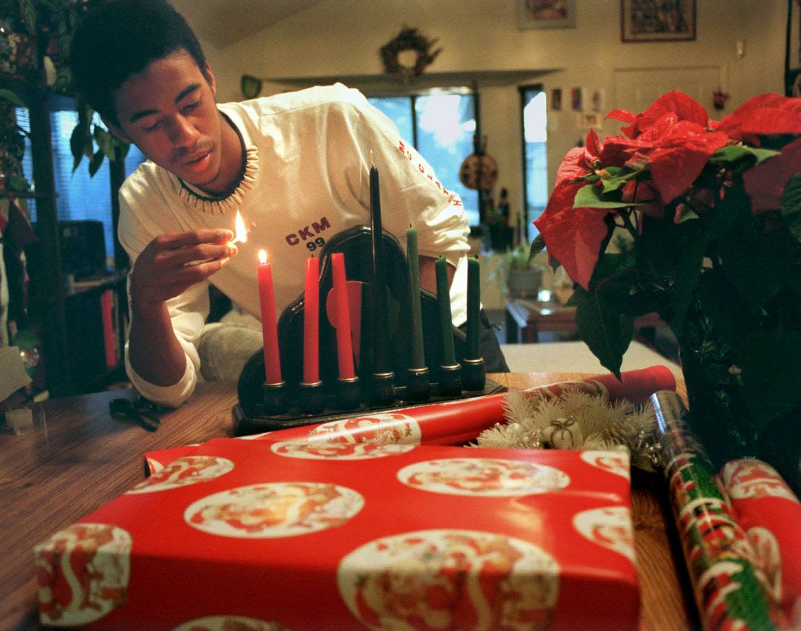 McClatchy High School junior Kahlfani Watson celebrates both Kwanza and Christmas at home in 1999. OWEN BREWER/Sacramento Bee file