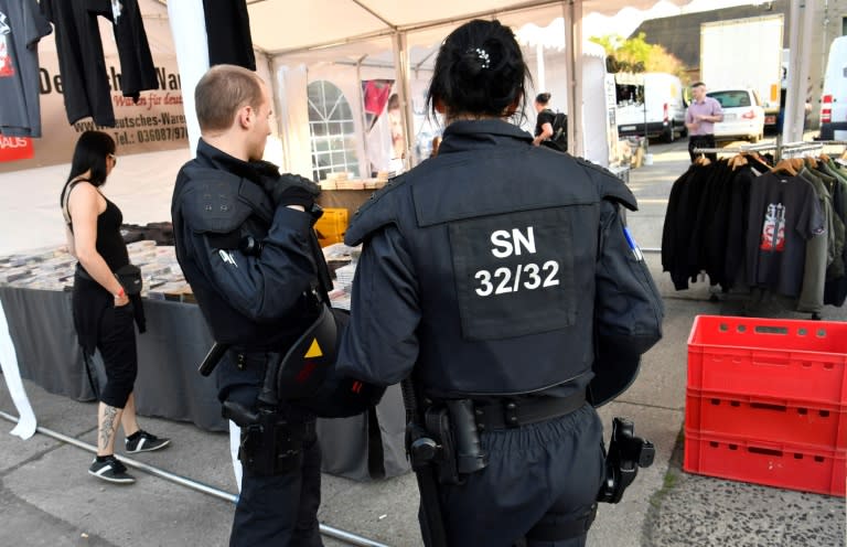 Police officers inspect the premises at the Shield and Sword neo-nazi festival in the eastern German town of Ostritz where hundreds of neo-Nazis were gathering on April 20, 2018, which marks Adolf Hitler's birthday