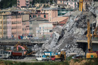 <p>Rubble from the collapse of the of the Morandi bridge on Aug. 14, 2018 in Genoa, Italy. At at least 38 people died when a large section of Morandi bridge built in the 1960s and part of the A10 motorway suddenly collapsed during a fierce storm sending vehicles falling up to 90m to the ground. (Photo from Paolo Rattini/Getty Images) </p>