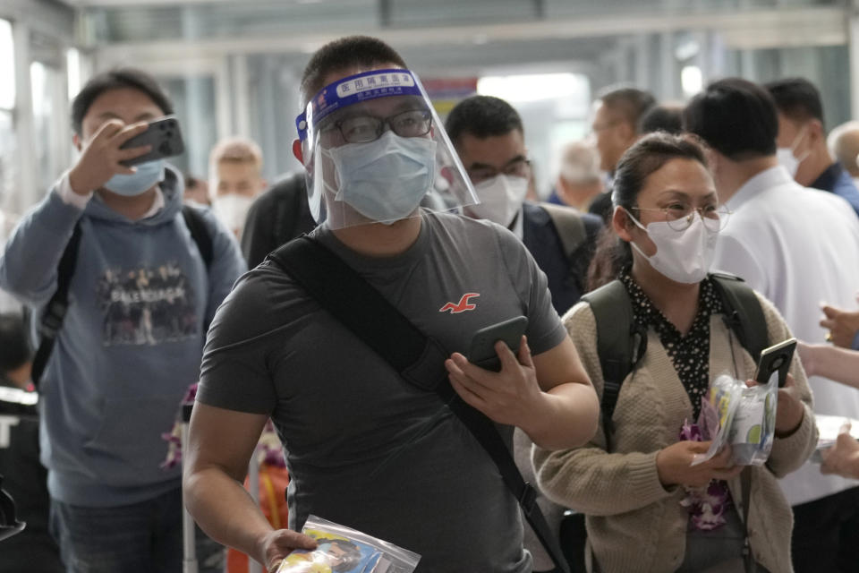 Chinese tourists arrive at Suvarnabhumi International Airport in Samut Prakarn province, Thailand, Monday, Jan. 9, 2023. Thailand is looking forward to hosting large numbers of visitors from China again after Beijing eased travel restrictions on Sunday. Chinese were about one-third of the total number of tourists visiting Thailand before the coronavirus pandemic, and the authorities hope they can help its lucrative tourism industry recover. (AP Photo/Sakchai Lalit)