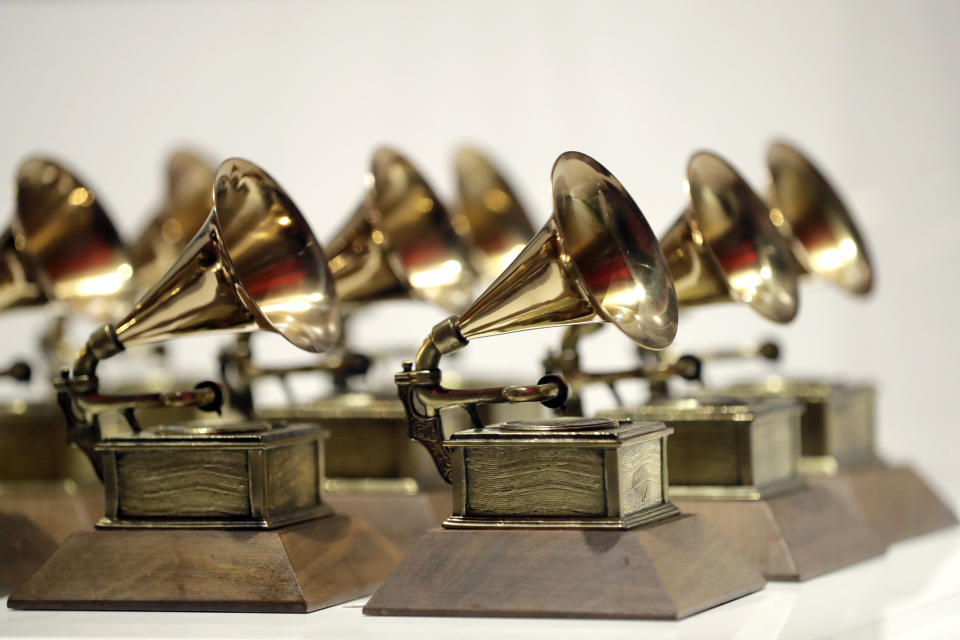 FILE - In this Oct. 10, 2017, file photo, various Grammy Awards are displayed at the Grammy Museum Experience at Prudential Center in Newark, N.J. Nominations for the 61st annual Grammy Awards will be announced Friday morning, Dec. 7, 2018. The Recording Academy delayed unveiling the nominees by two days because former President George H.W. Bush's funeral and public viewing this week in Washington. (AP Photo/Julio Cortez, File)