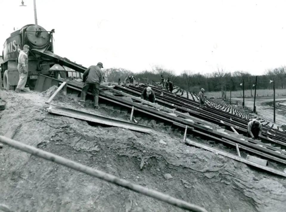 In this 1953 file photo, workers prepare to pour concrete for supports for the stands at Barberton Speedway. The stands were installed, part of a $30,000 face-lift in time for the stock car race opener in April 1953.