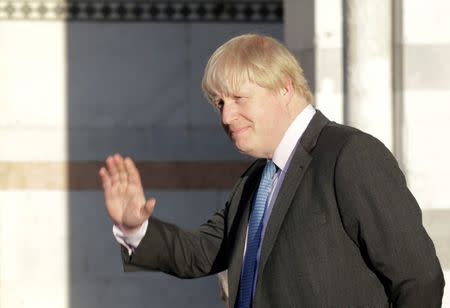 Britain's Foreign Secretary Boris Johnson gestures as he poses for a family photo during a G7 for foreign ministers in Lucca, Italy April 10, 2017. REUTERS/Max Rossi