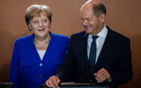 Merkel and Scholz - Credit: CLEMENS BILAN/EPA-EFE/REX