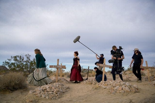 Rebecca Holopter, red dress, and Verity Butler, far left, on the set of their Western horror television show. The two friends are preparing for production of their first feature-length film, "Big Mike's Cabin," which will be filmed in the Ozarks.
