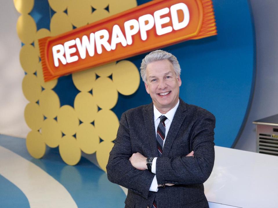 In this 2014 photo provided by the Food Network, judge and host, Marc Summers, poses for a portrait on set during the filming of Food Network's "Rewrapped," Season 1, in Montclair, N.J. The reality TV show is a cooking competition in which three chefs create their version of famous snacks. It debuts April 21, on Food Network with host Joey Fatone. (AP Photo/Food Network, Anders Krusberg)