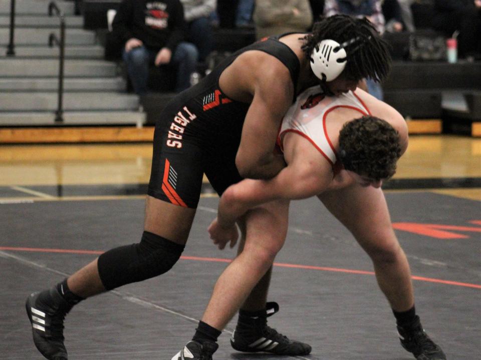 Taunton's Elijah Prophete tries to take down Milford's Owen Matthews during a Hockomock League dual meet at Taunton High School.