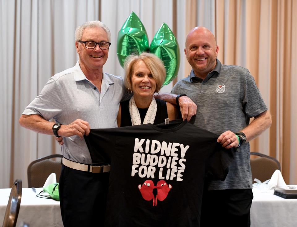 Kidney transplant recipient Michael Dailey of Warren, donor Linda Liberator of North Canton, and her son Eric Jones of Massillon, also a kidney recipient, meet earlier this month for a celebration and to discuss their journey at Tozzi's on 12th in Canton.