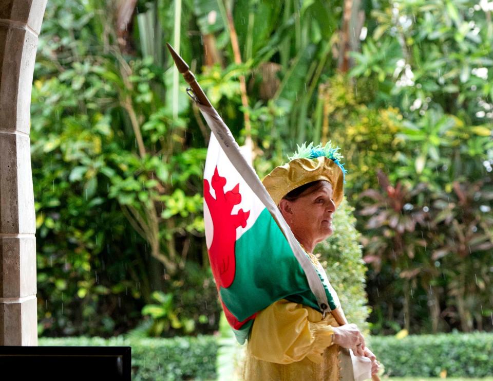 Dressed as a flagbearer, Johanna Reyers prepares for the 2024 Boar's Head and Yule Log Festival on Saturday at The Episcopal Church of Bethesda-by-the-Sea in Palm Beach.