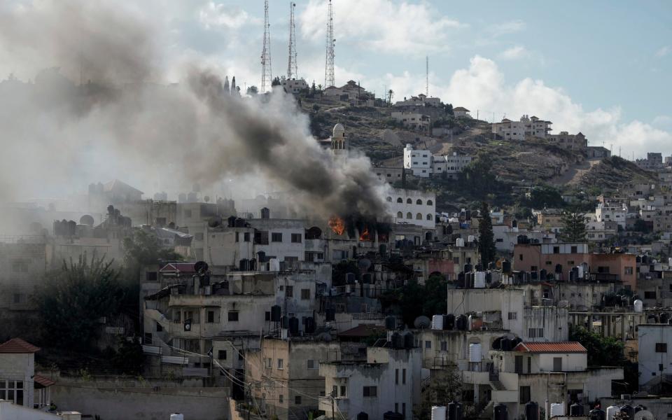 Fire and smoke rises during an Israeli army operation in Jenin, West Bank