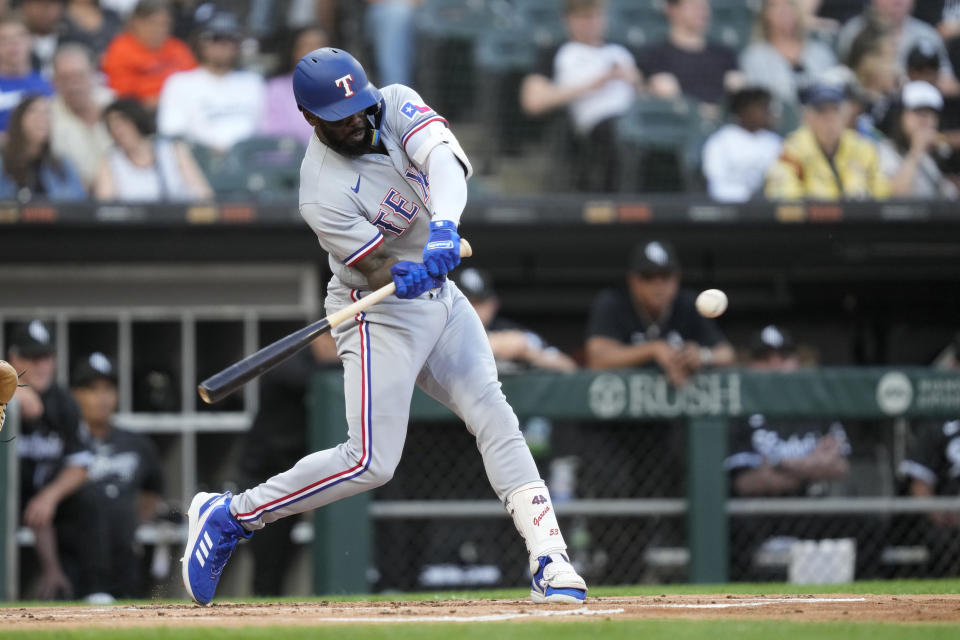 Texas Rangers' Adolis Garcia hits an RBI double off Chicago White Sox starting pitcher Tanner Banks during the first inning of a baseball game Monday, June 19, 2023, in Chicago. (AP Photo/Charles Rex Arbogast)