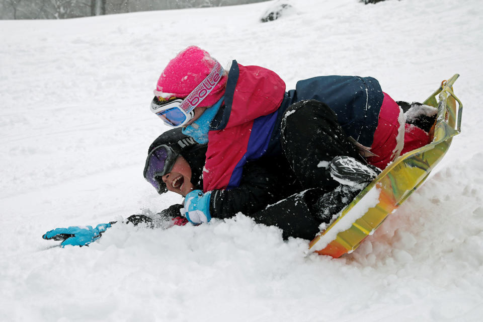 <p>Children ride a sled during a snowstorm in Central Park in New York, Feb. 9, 2017. (Photo: Mike Segar/Reuters) </p>