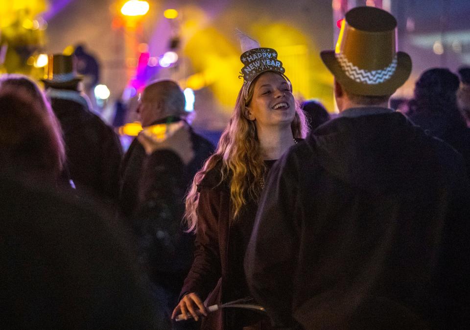 Eva Bangert of Winnipeg, Canada, dances with family during the annual New Years Eve block party at Agua Caliente Casino in Palm Springs, Calif., Saturday, Dec. 31, 2022. 