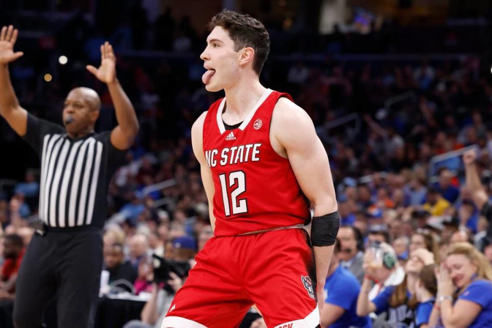 N.C. State’s Michael O’Connell (12) celebrates after hitting a three-pointer during the second half of N.C. State’s 74-69 victory over Duke in the quarterfinal round of the 2024 ACC Men’s Basketball Tournament at Capital One Arena in Washington, D.C., Thursday, March 14, 2024. Ethan Hyman/ehyman@newsobserver.com