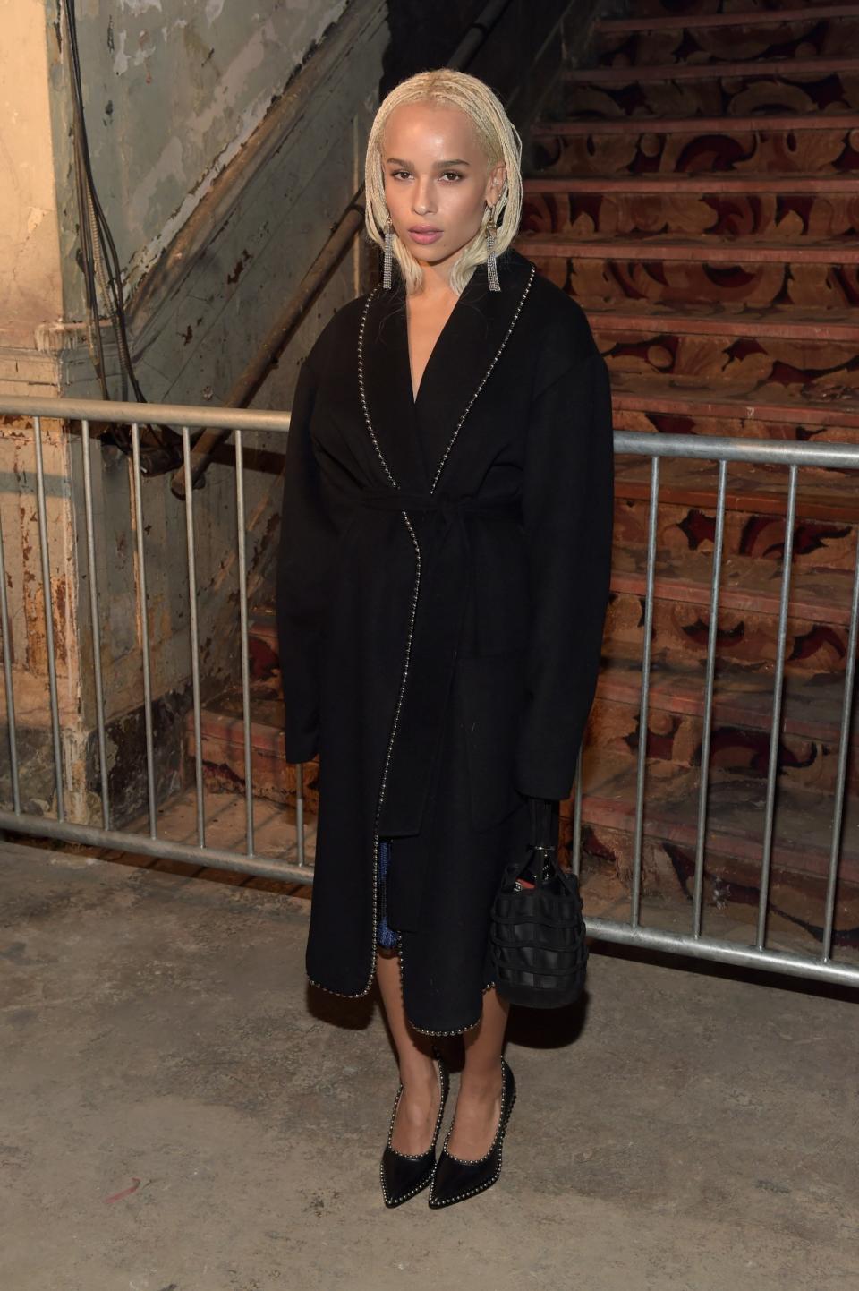 <p>Zoe Kravitz covered up in an elegant black coat and matching heels. <i>[Photo: Getty]</i> </p>