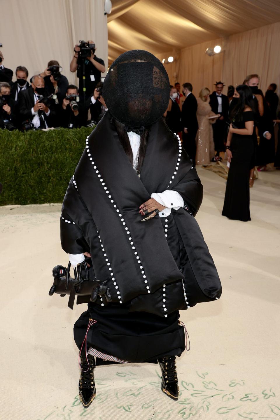 Erykah Badu saves face in Thom Browne (Getty Images for The Met Museum/)