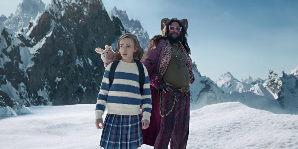 This image released by Netflix shows Marlow Barkley, left, and Jason Momoa in a scene from "Slumberland." (Netflix via AP)