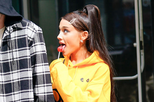 Ariana Grande Stomps Out in Bold Yellow Thigh-Highs & a Hoodie
