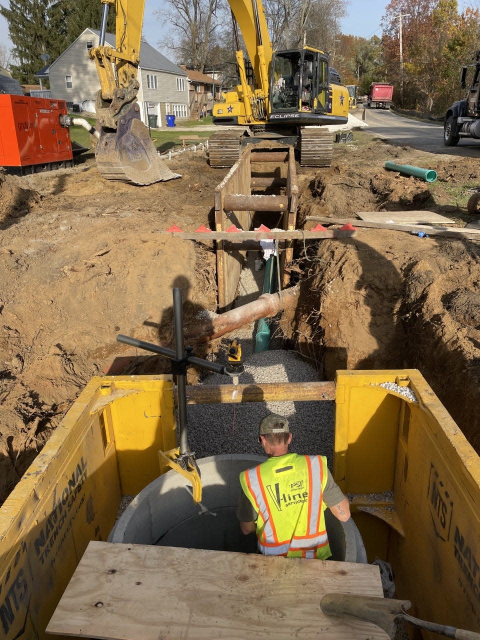 Contractors work on a sanitary sewer pump station in Kent. Infrastructure funding, which could help pay for projects like this, are slowly finding their way to Ohio, but it's not clear how much money is coming, or what the restrictions might be.