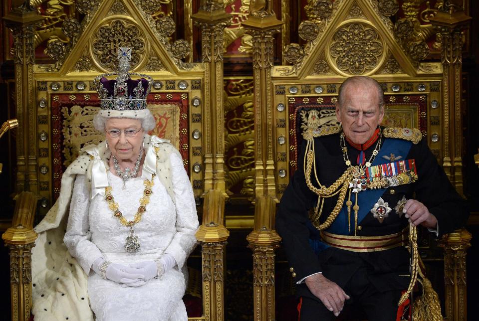 Queen Elizabeth II seated on the Throne in the House of Lords next to Prince Philip, Duke of Edinburg as she prepares to deliver the Queen's Speech during the State Opening of Parliament at the Palace of Westminster on June 4, 2014.