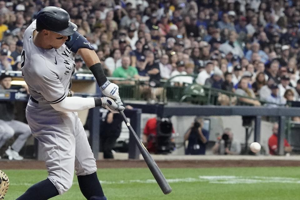 New York Yankees' Aaron Judge hits a single during the second inning of a baseball game against the Milwaukee Brewers Friday, Sept. 16, 2022, in Milwaukee. (AP Photo/Morry Gash)