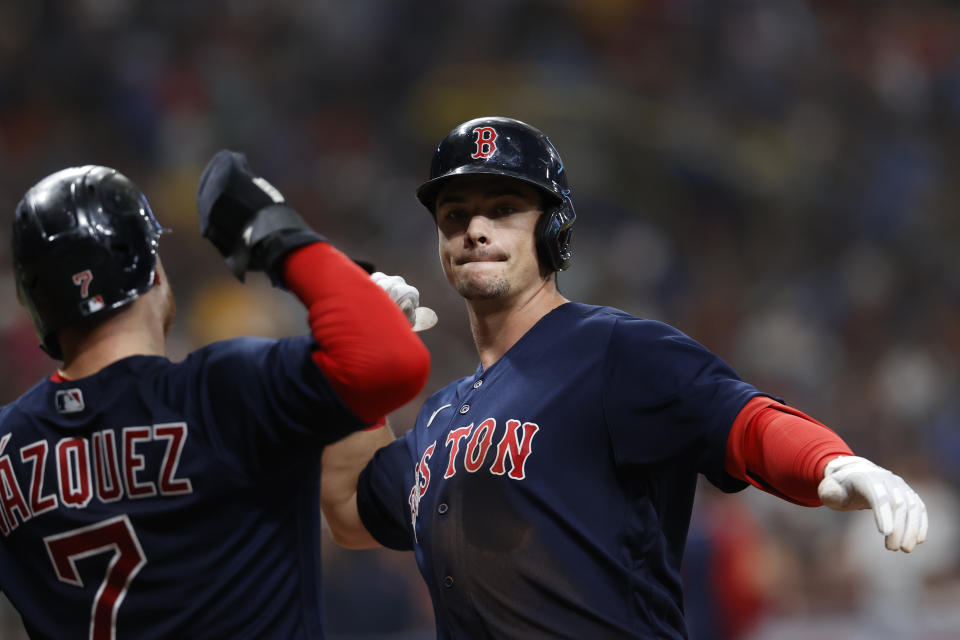 Boston Red Sox's Bobby Dalbec celebrates his two-run home run with Christian Vazquez (7) during the fifth inning of a baseball game against the Tampa Bay Rays on Saturday, July 31, 2021, in St. Petersburg, Fla. (AP Photo/Scott Audette)